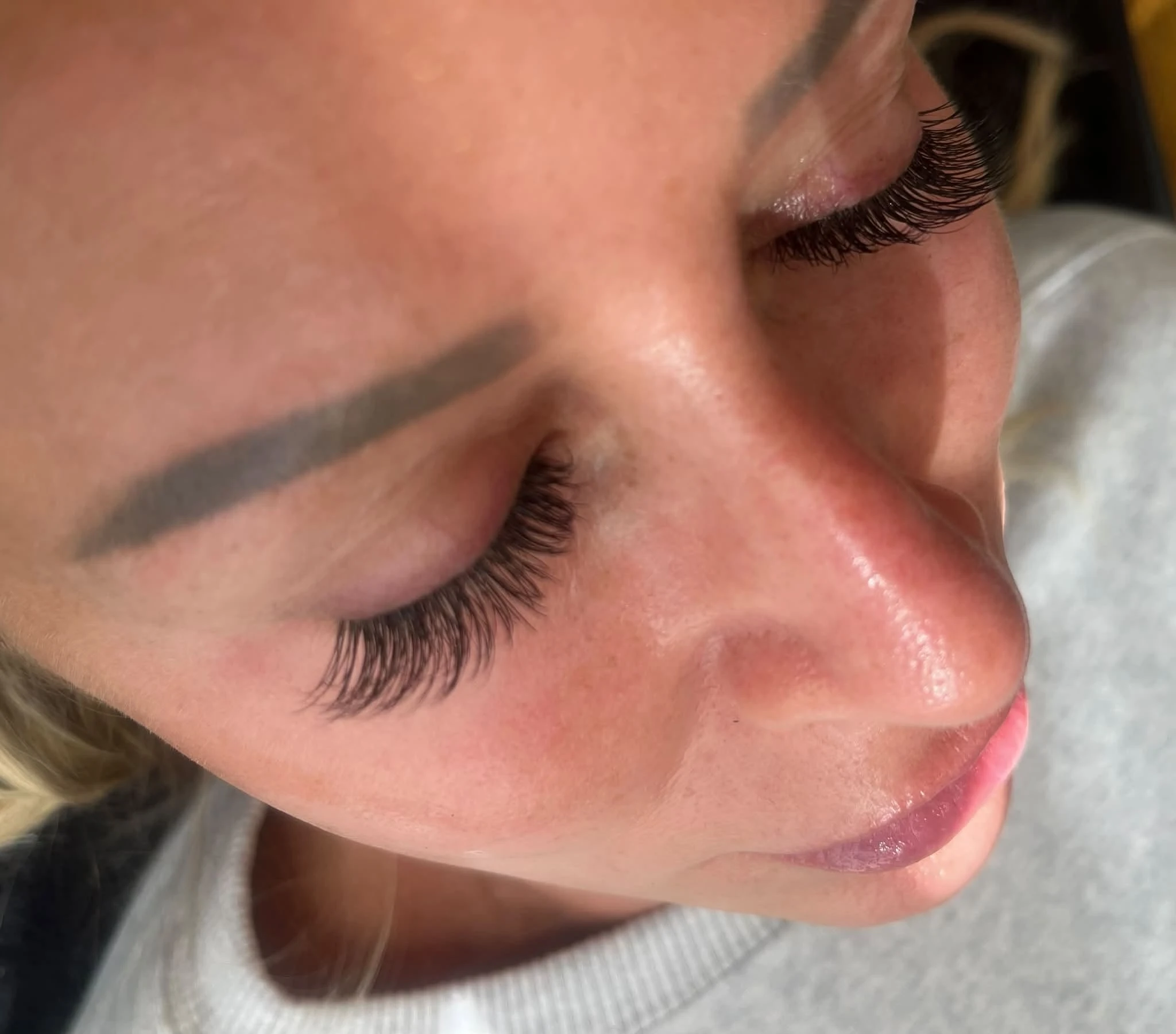 Close-up of softly curled lashes on a Lash Bomb KC client with closed eyes